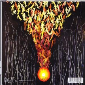 Albumcover mit abstrakten Figuren in Gelb und Orange, mit einem hellen Kreis unten.