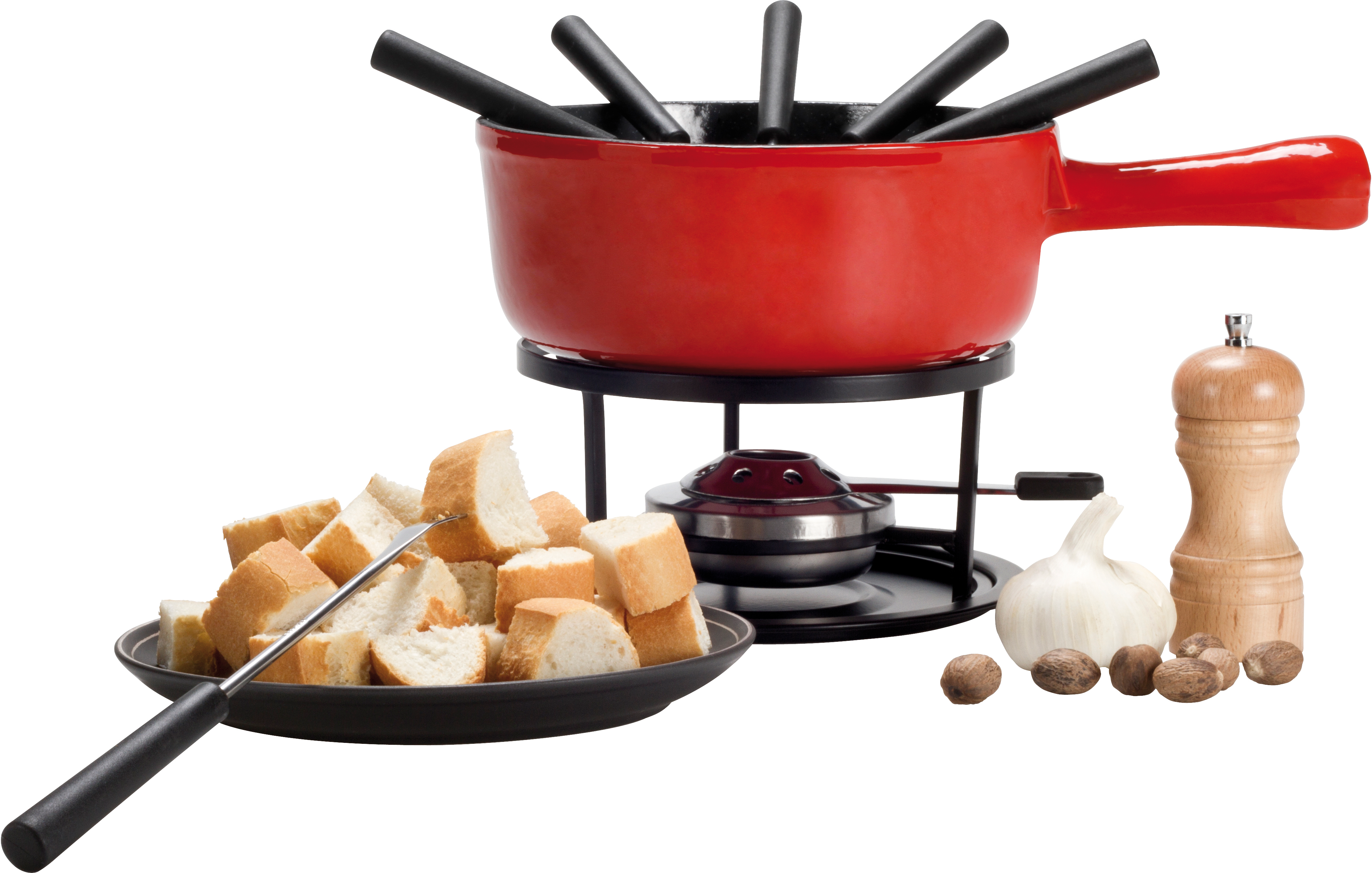 Un service à fondue avec du pain, une gousse d'ail, de la muscade et un moulin à poivre.