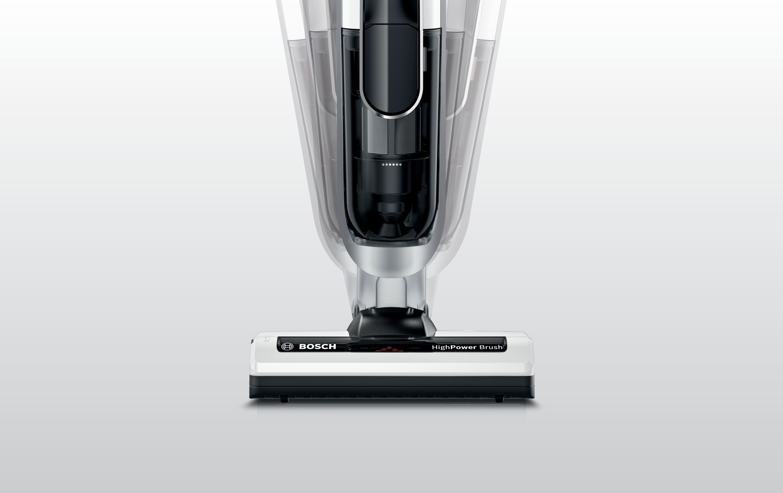 Nahaufnahme der Basis eines kabellosen Staubsaugers, die HighPowerBrush und den transparenten Staubbehälter zeigt.