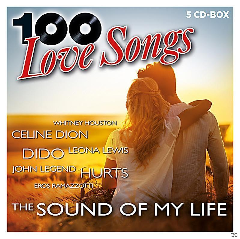 Albumcover. 100 Love Songs Titel. Paar umarmt sich, Sonnenuntergang im Hintergrund. Künstler gelistet.