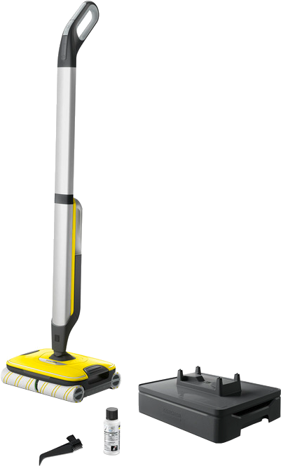 Machine de nettoyage de sol jaune et argent. Elle a une poignée et une base avec des rouleaux. Accessoires noirs.