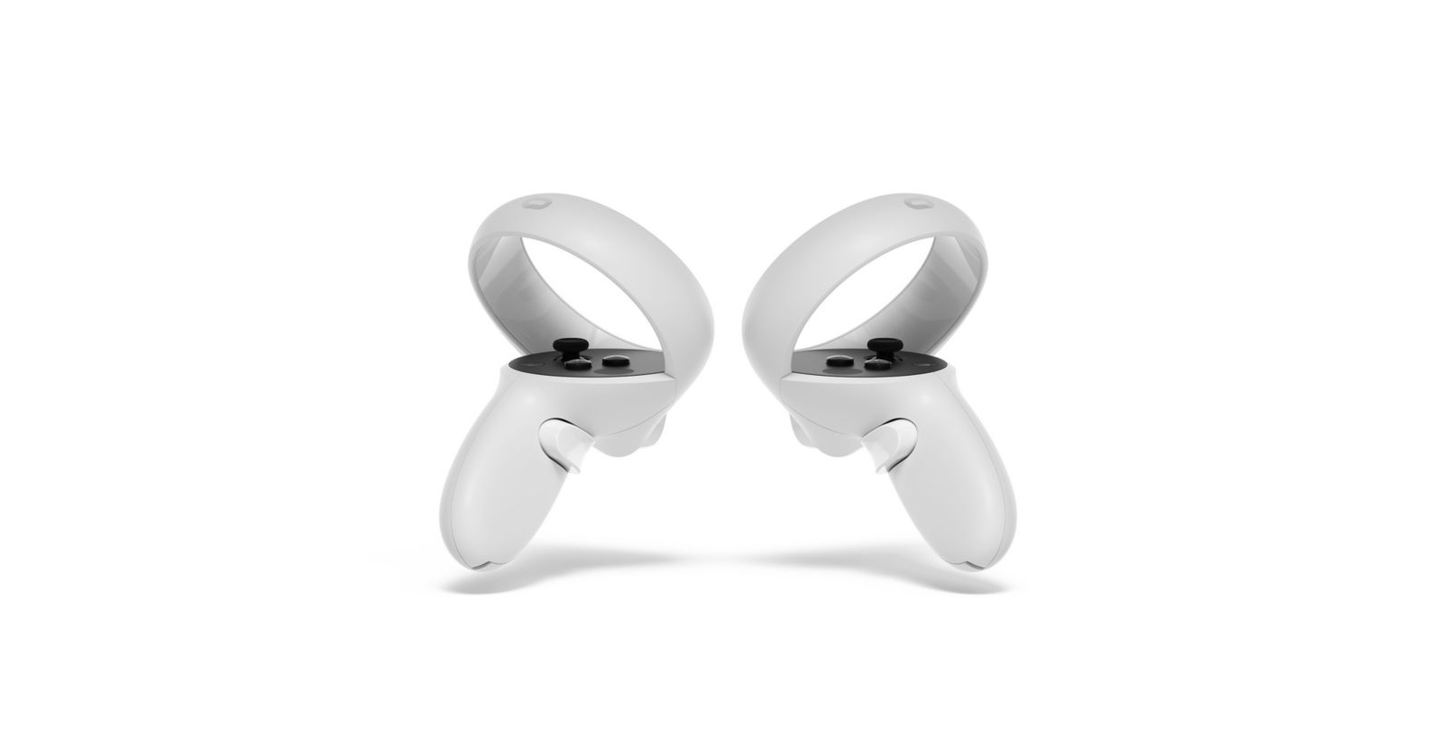 Dos controladores VR blancos con botones negros, aislados en blanco.