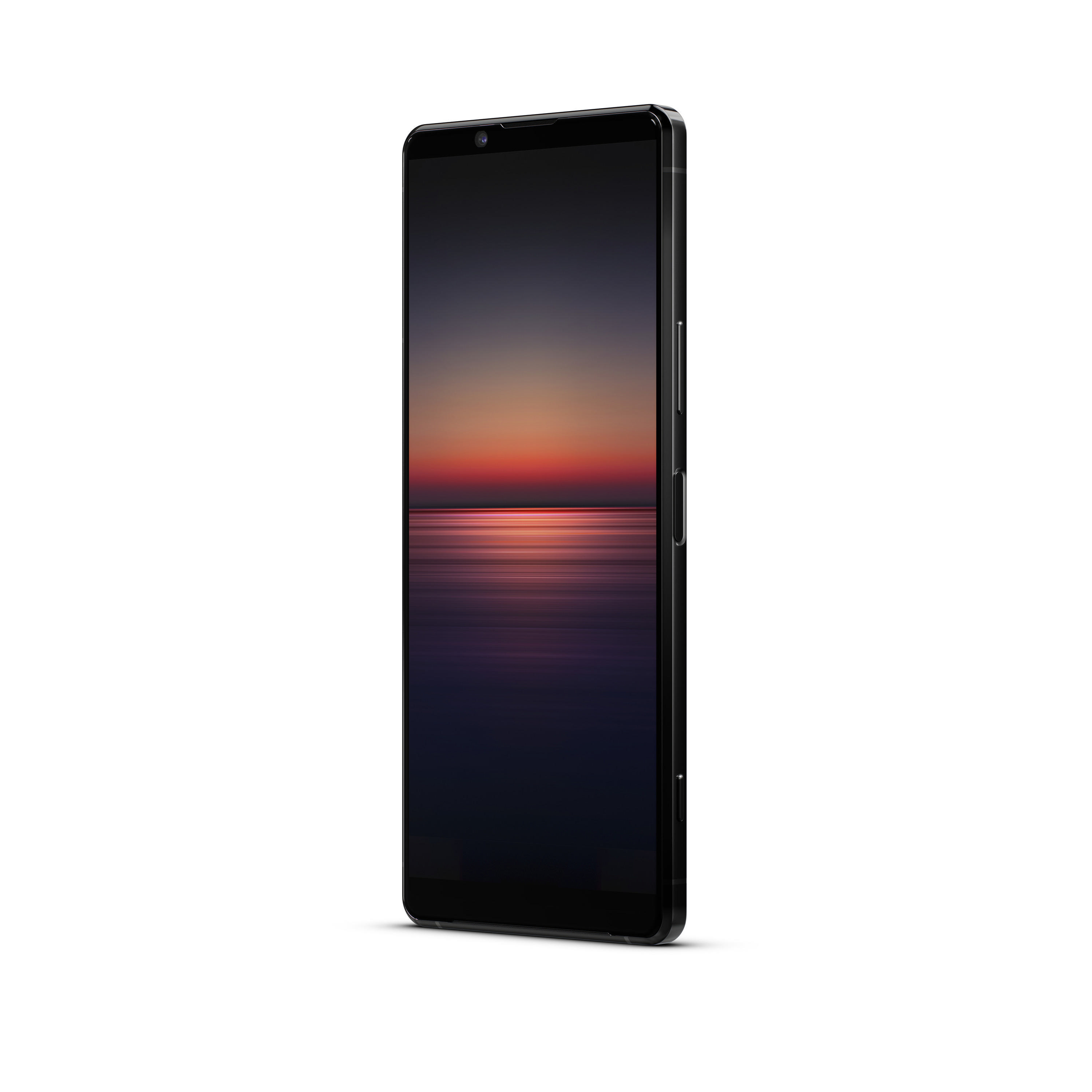 Schwarzes Smartphone im Winkel, zeigt ein dunkles Sonnenuntergangsbild auf dem Bildschirm, weißer Hintergrund.