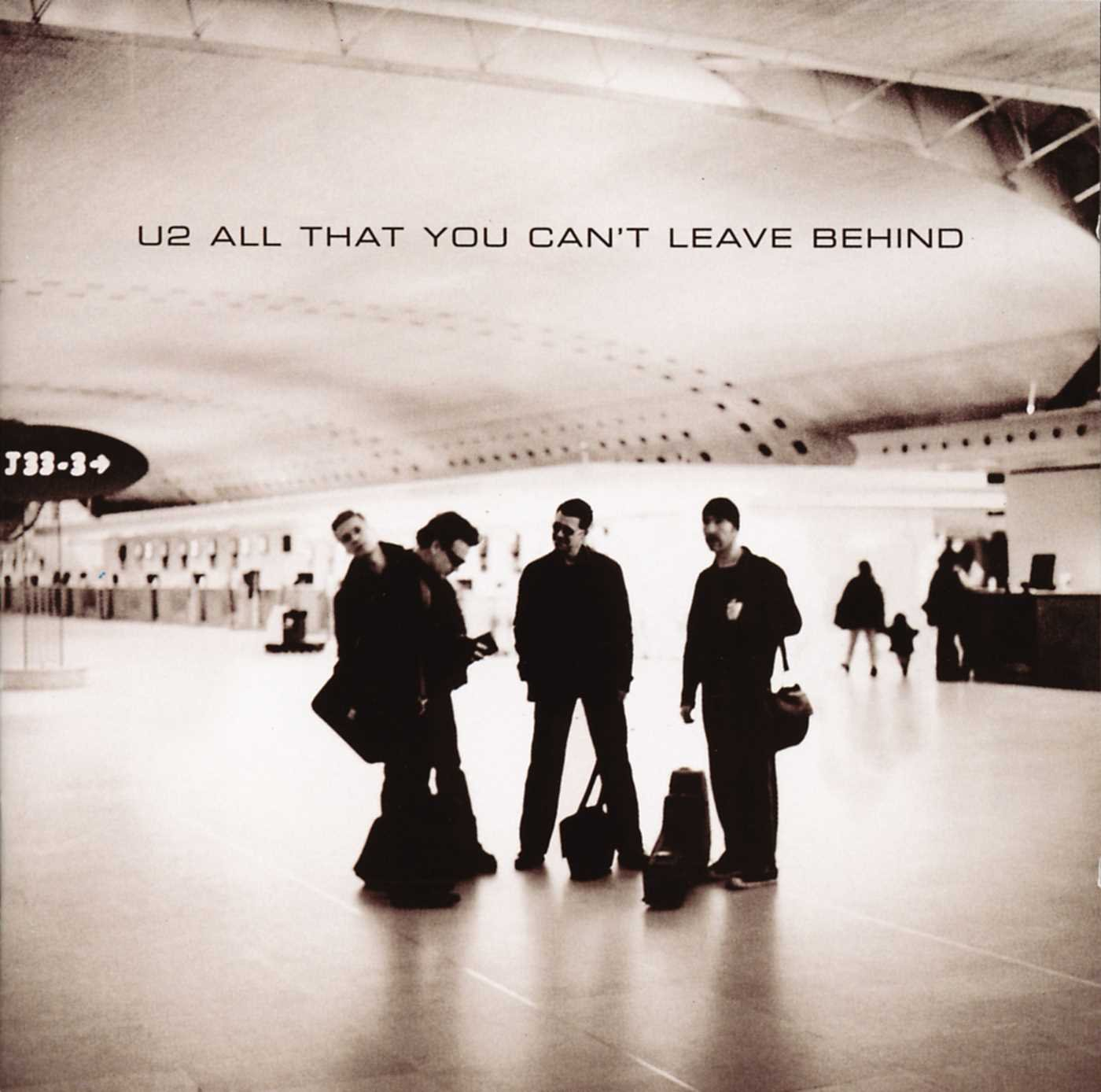 U2 album borító a zenekar tagjaival a terminálban. Szépia tónus.