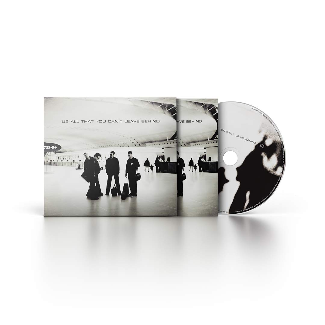 U2 album borító. Zenekar a repülőtéren, CD tok nyitva. CD jobbra, fehér háttér.