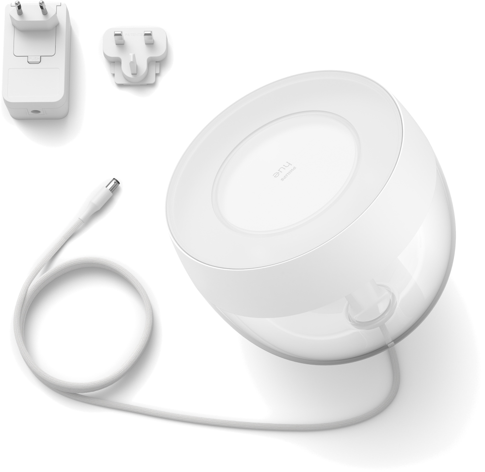 White lamp with attached cord, power adapter, and additional plug. Lamp is tilted at an angle.