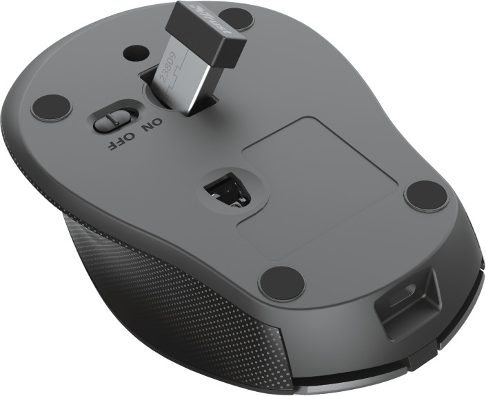 Souris d'ordinateur noire retournée, avec un récepteur USB inséré.