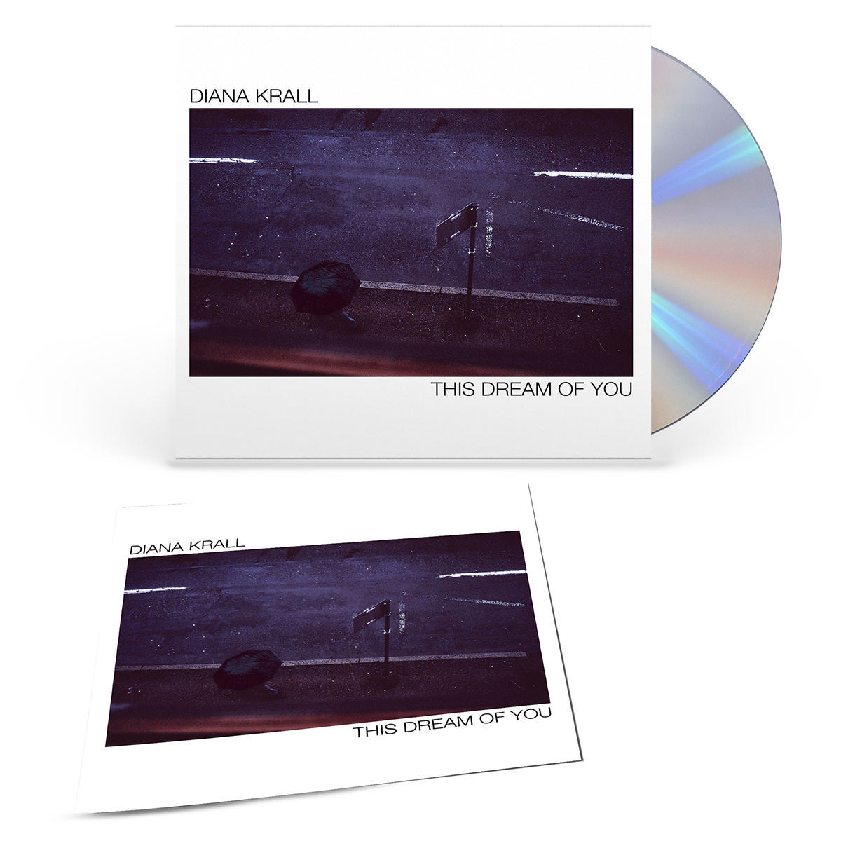 Albumcover und CD von Diana Kralls "This Dream Of You", die eine Stadtstraßenszene zeigen.