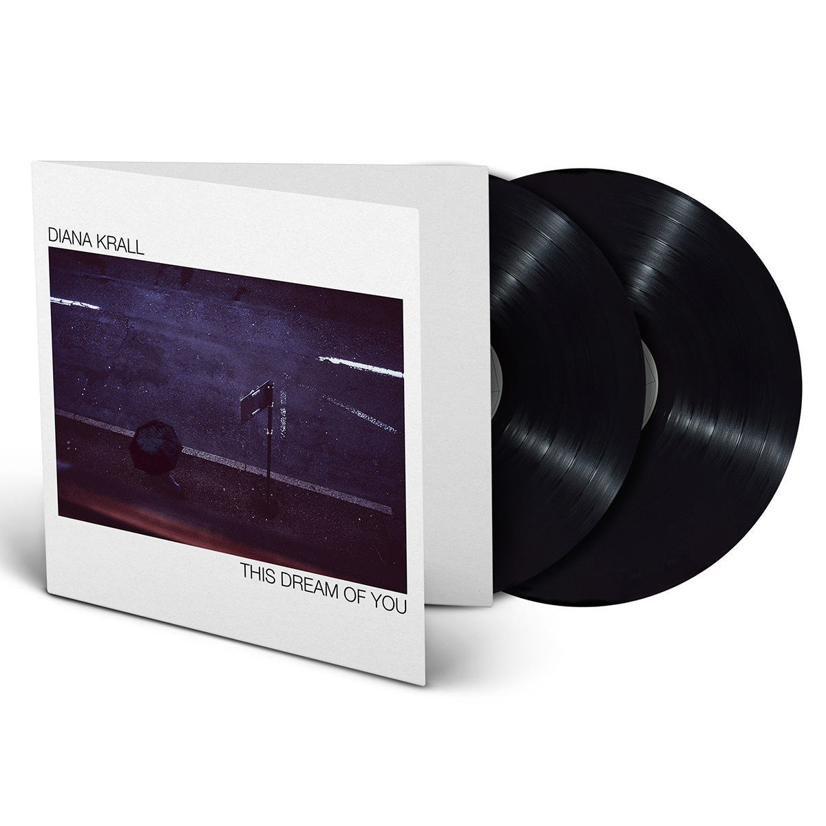 Albumcover und zwei schwarze Schallplatten.