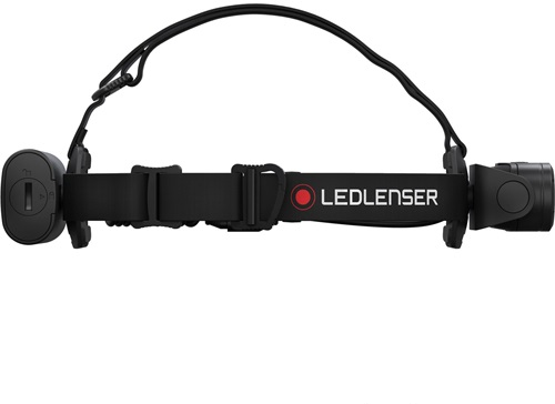 LEDLenser fejlámpa. Fekete pánt, jobbra a lámpa, balra az akkumulátor.