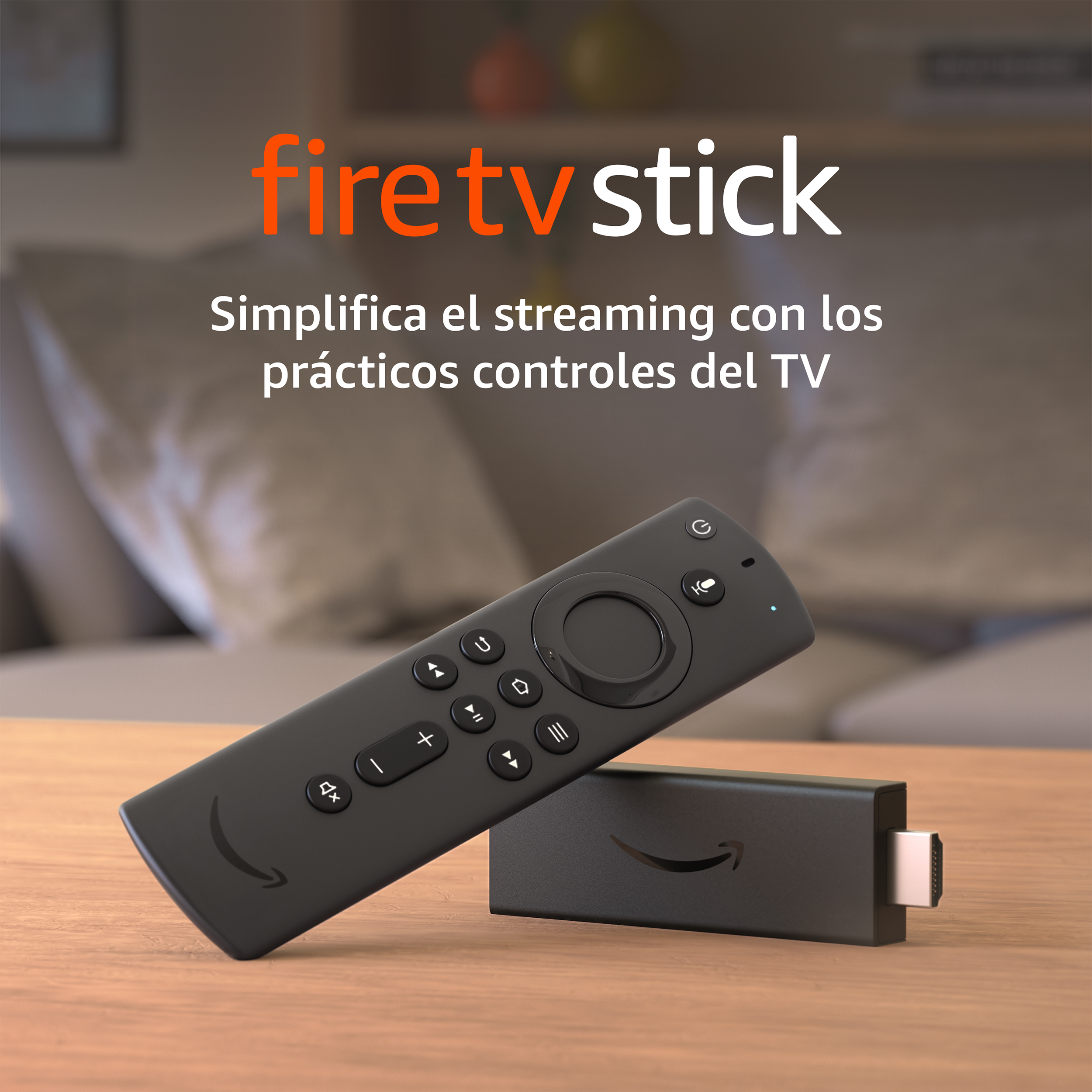 Fire TV Stick negro con un mando a distancia sobre una mesa. El texto dice 'Fire TV Stick' en naranja.