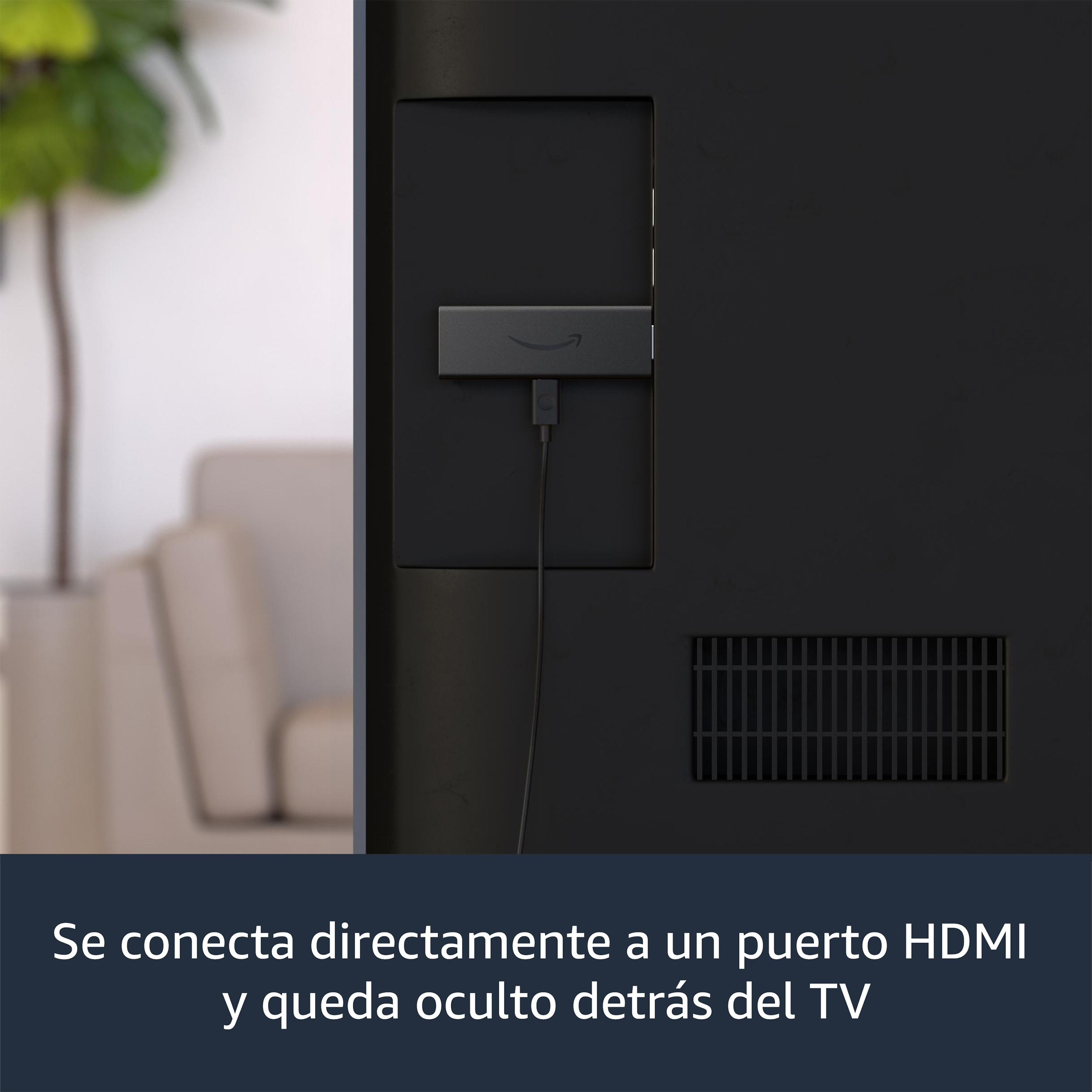 Amazon Fire TV Stick negro conectado a un televisor, con texto en español.