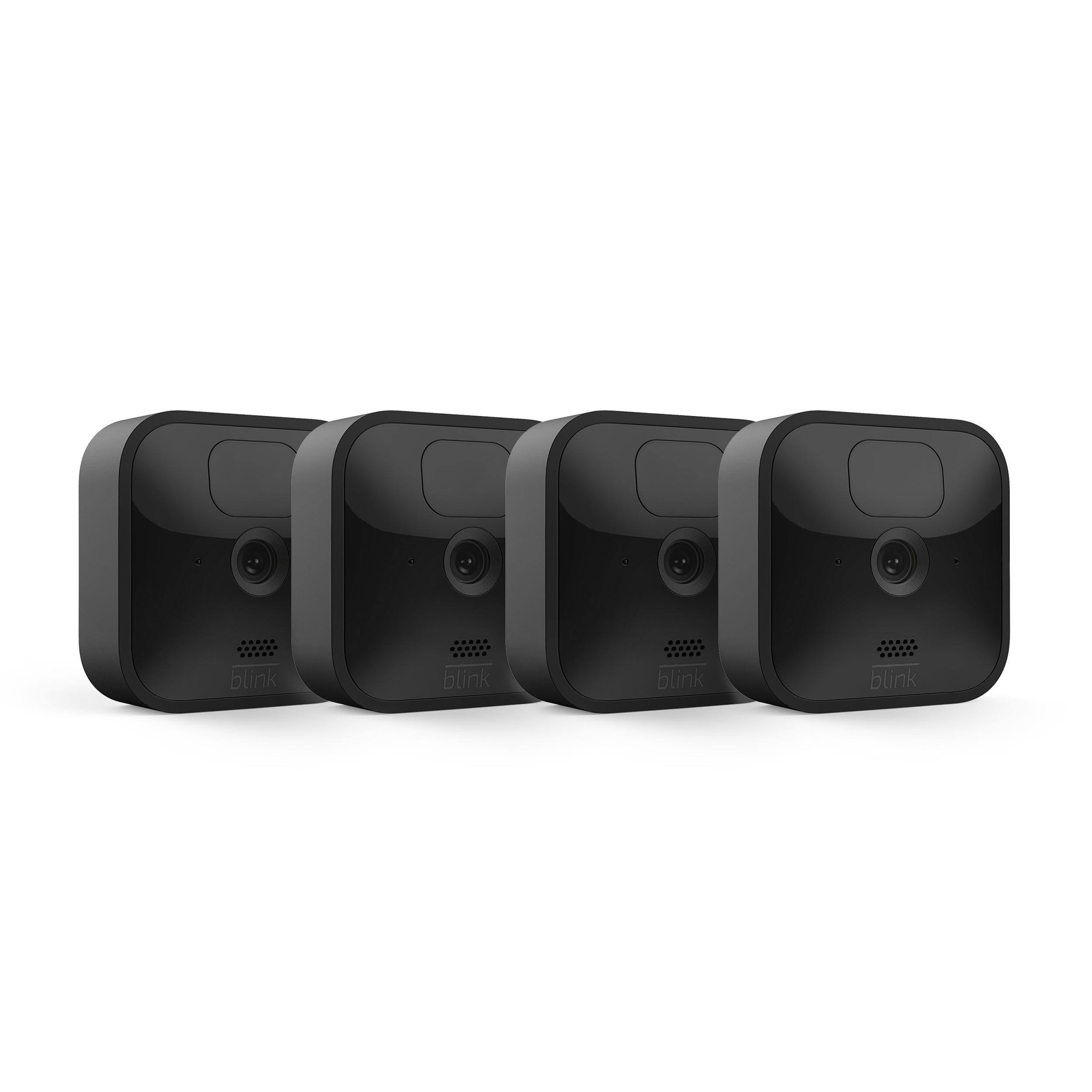 Vier schwarze Blink-Sicherheitskameras. Quadratische Form, nach vorne gerichtete Linse. Einfaches Design.