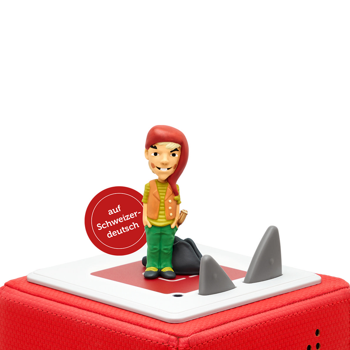 Eine Spielfigur eines Mannes mit roter Mütze, stehend auf roter Basis. Haifischflossen sind sichtbar.