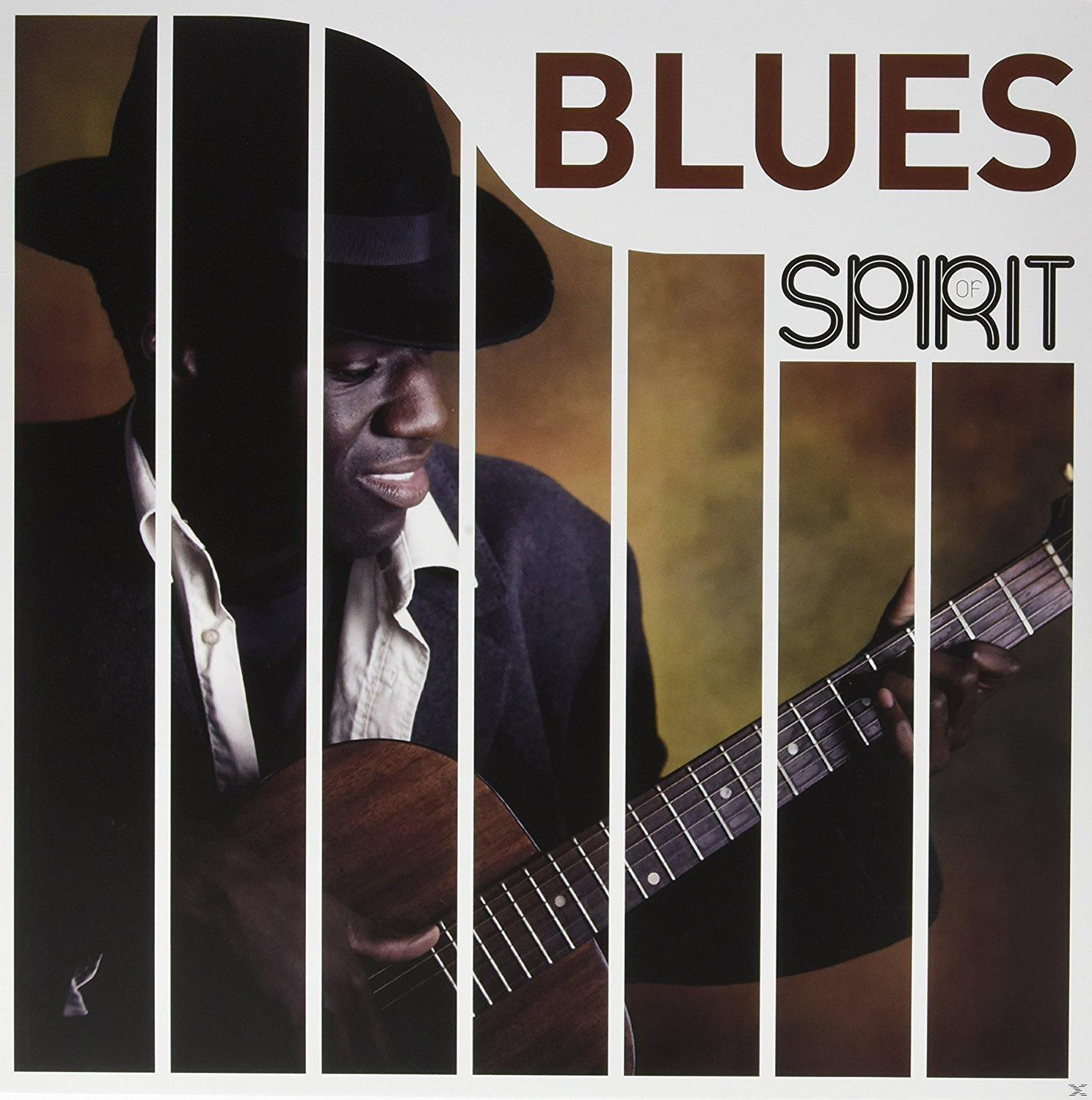 Image d'un homme jouant de la guitare, avec les mots 'BLUES' et 'SPIRIT' écrits à droite.