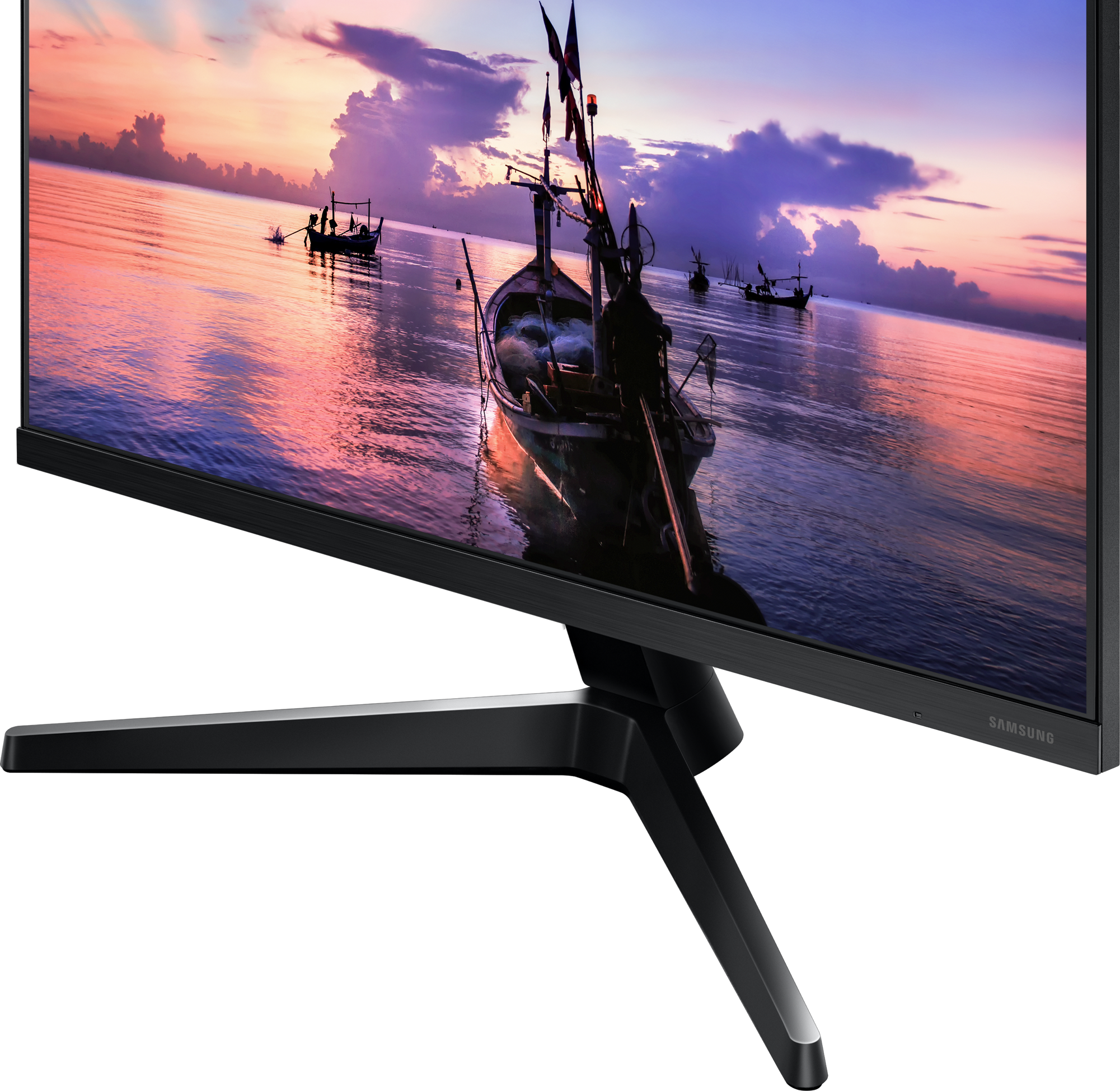 Ein Computermonitor, der einen Sonnenuntergang über dem Meer mit Booten zeigt, schräge Ansicht.