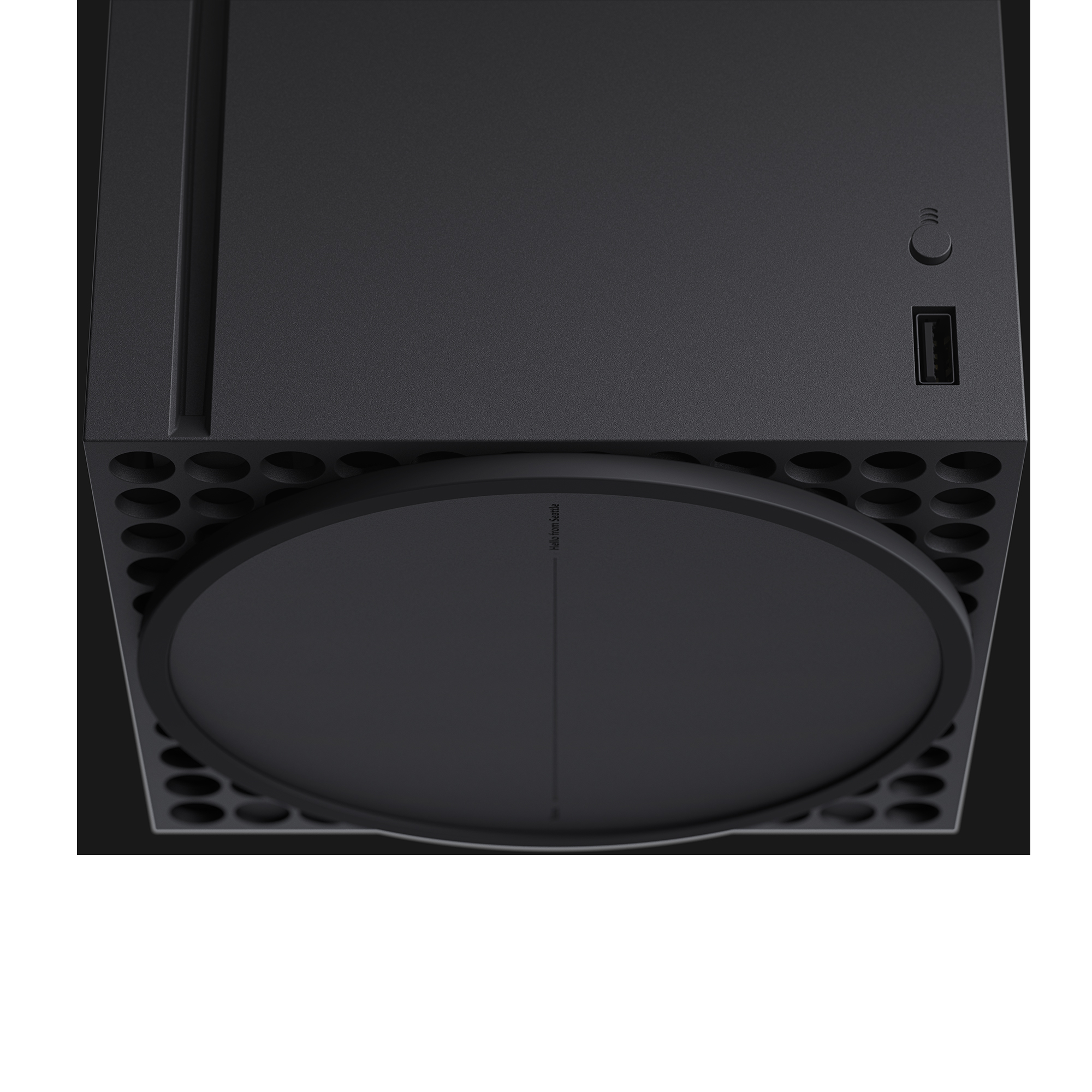 Siyah Xbox Series X konsolu, üstten görünüm. Bir disk yuvası, güç düğmesi, USB bağlantı noktası ve hava delikleri bulunur.