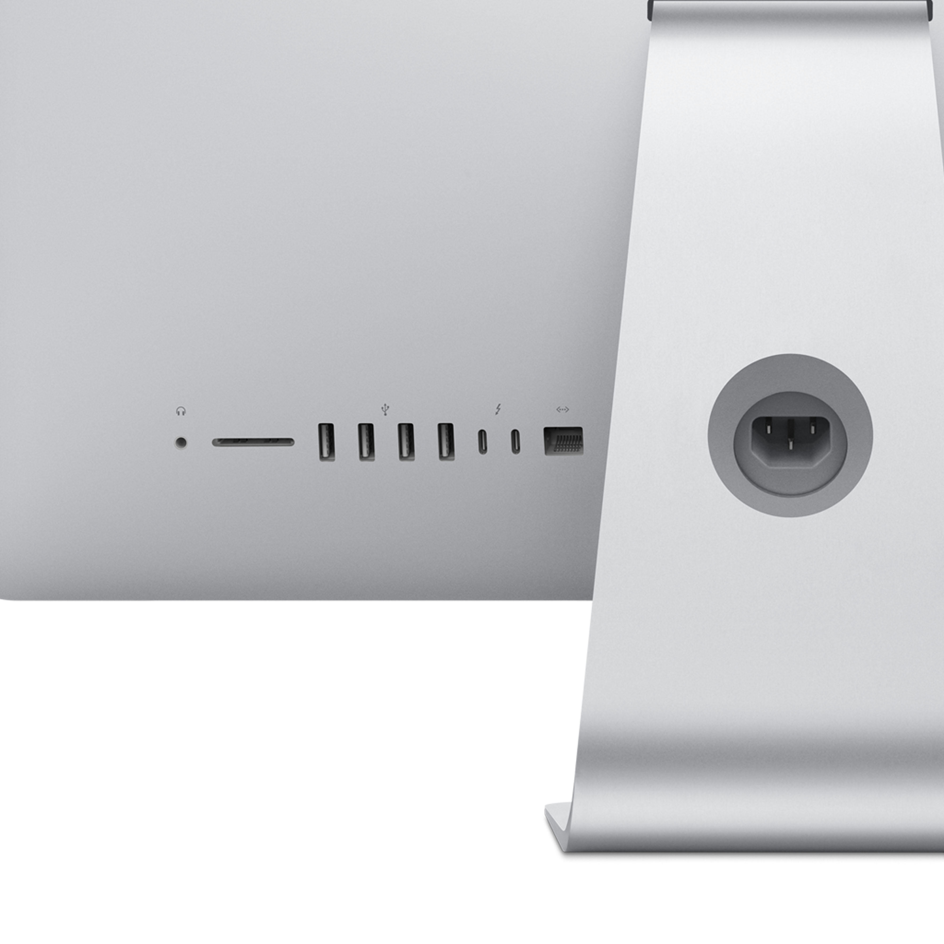 Rückseite eines silbernen iMac-Computers, Anschlüsse links, Ständer rechts.
