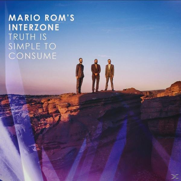 Albumcover mit drei Männern auf einem Felsen, blauem Himmel und Text: Mario Rom's Interzone.