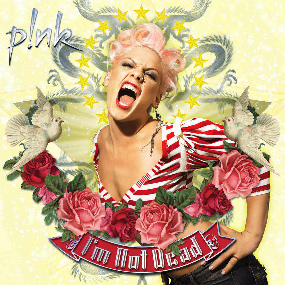 Pink album borító P!nk énekesnővel, rózsákkal és galambokkal, sárga csillagos háttérrel.