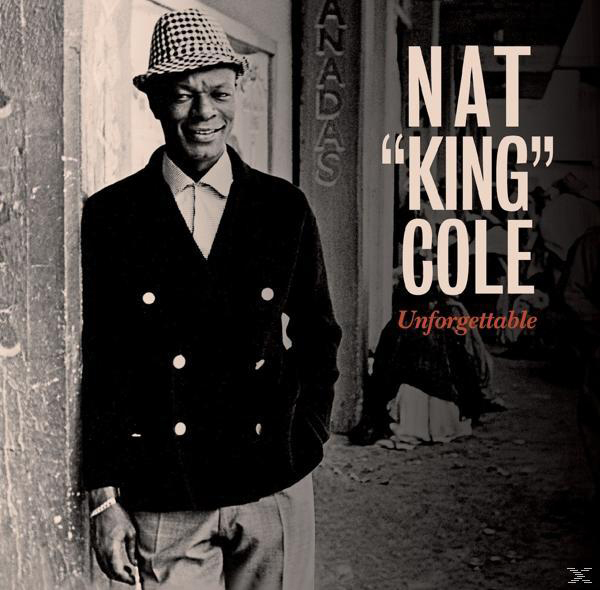 Albumcover von Nat King Cole, lächelnd mit kariertem Hut, an einer Mauer lehnend.