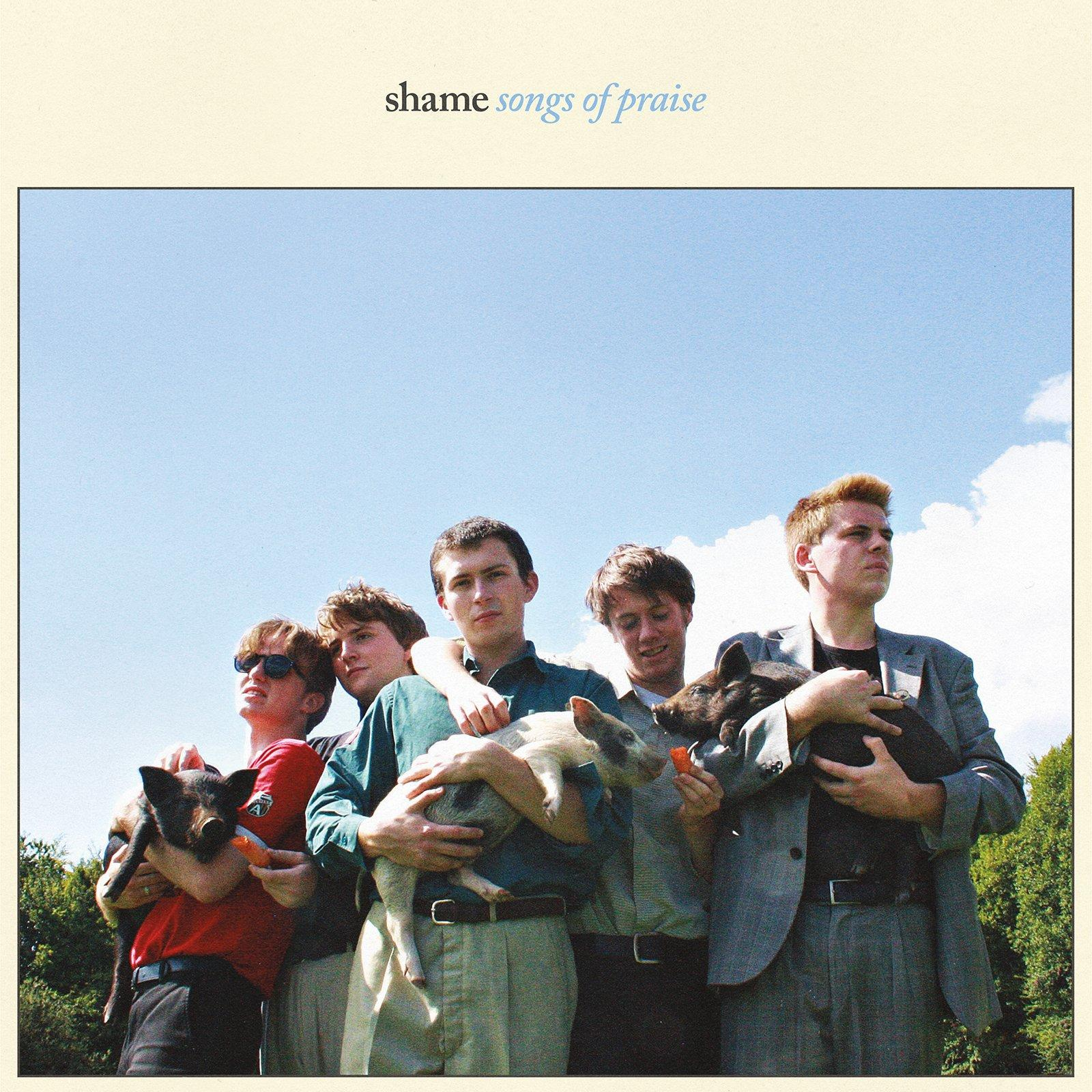 Albumcover. Fünf Männer mit Schweinen. Blauer Himmel im Hintergrund. Text: shame songs of praise.