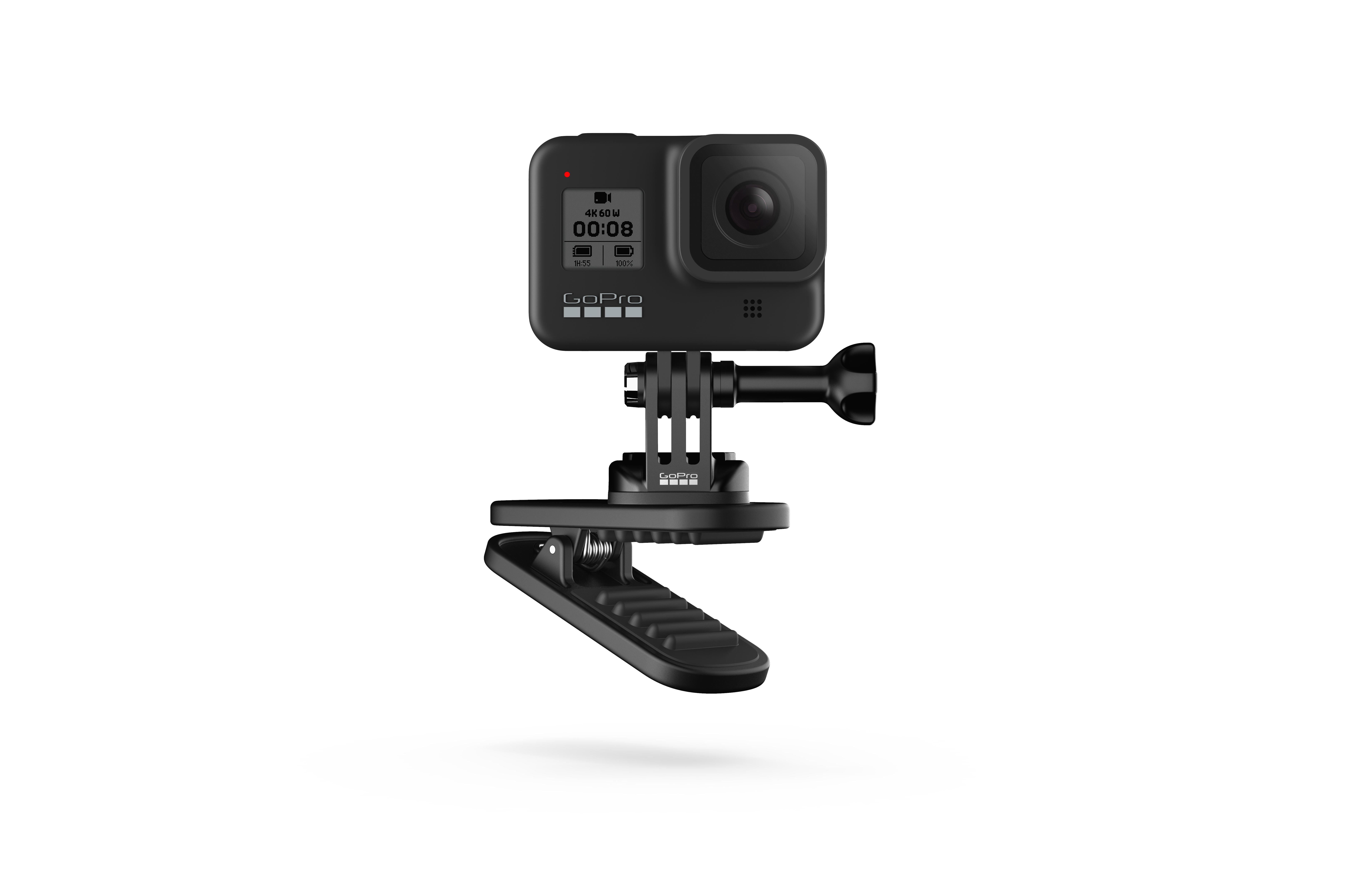 Schwarze GoPro-Kamera auf schwarzem Clip montiert. Die Kamera zeigt einen Bildschirm.