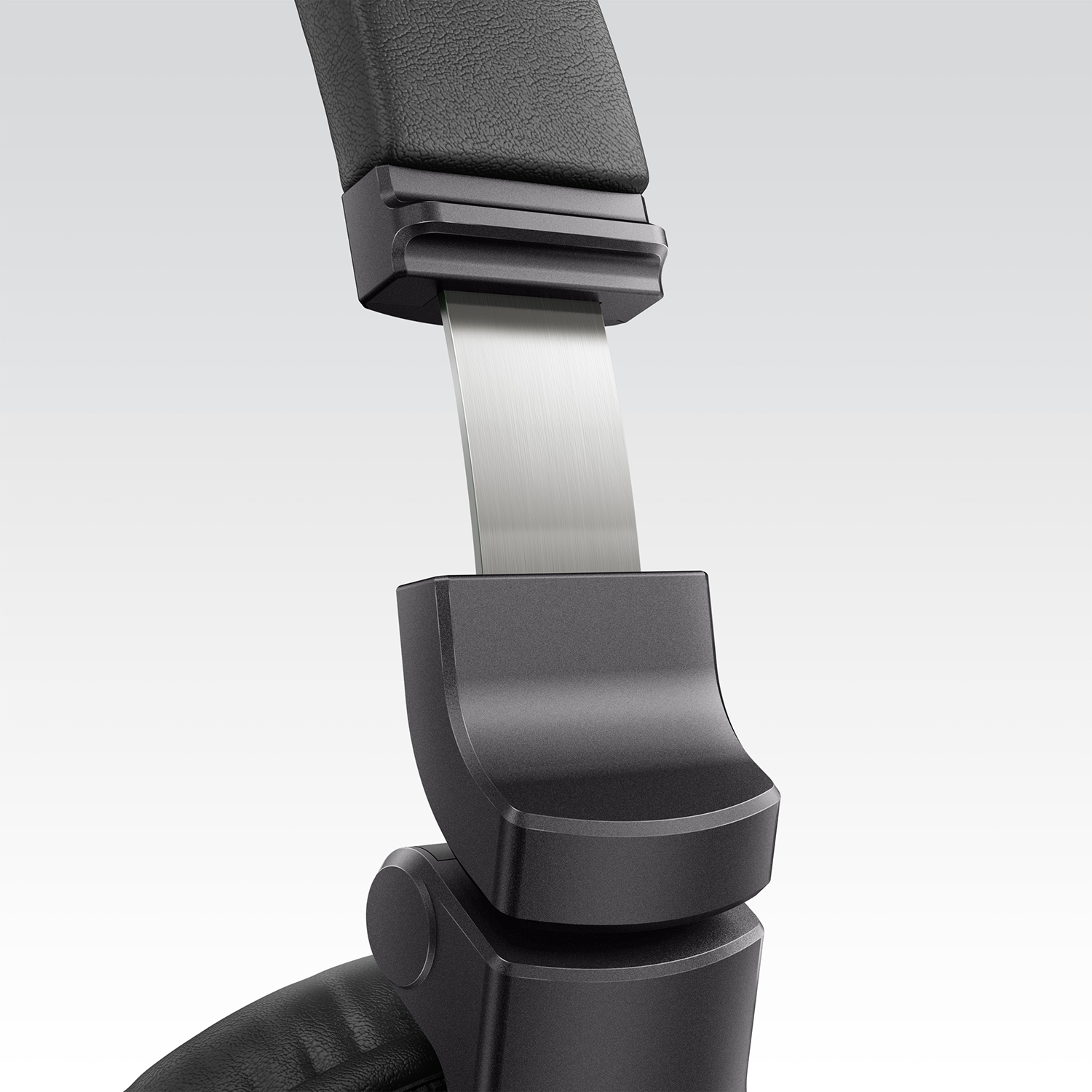 Close-up of headphones, showing the adjustable connection point.