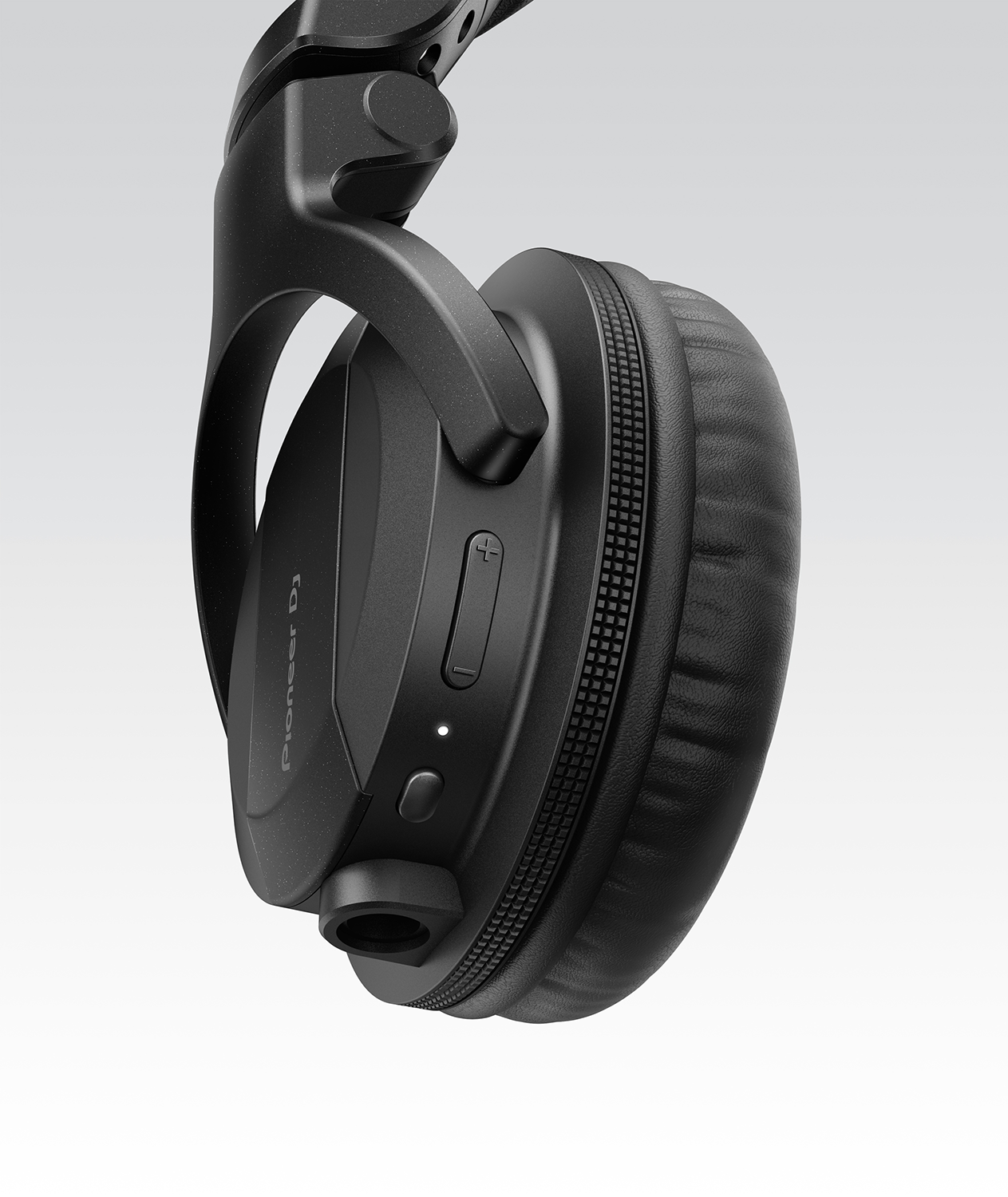 Black Pioneer DJ headphones, side view, controls visible.