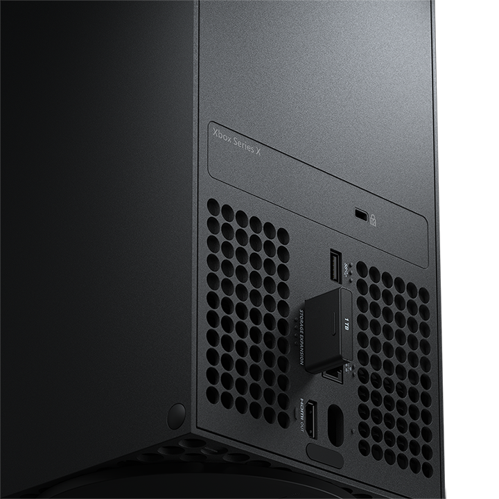 Black Xbox Series X console with an expansion card inserted. The back is black and has vents.