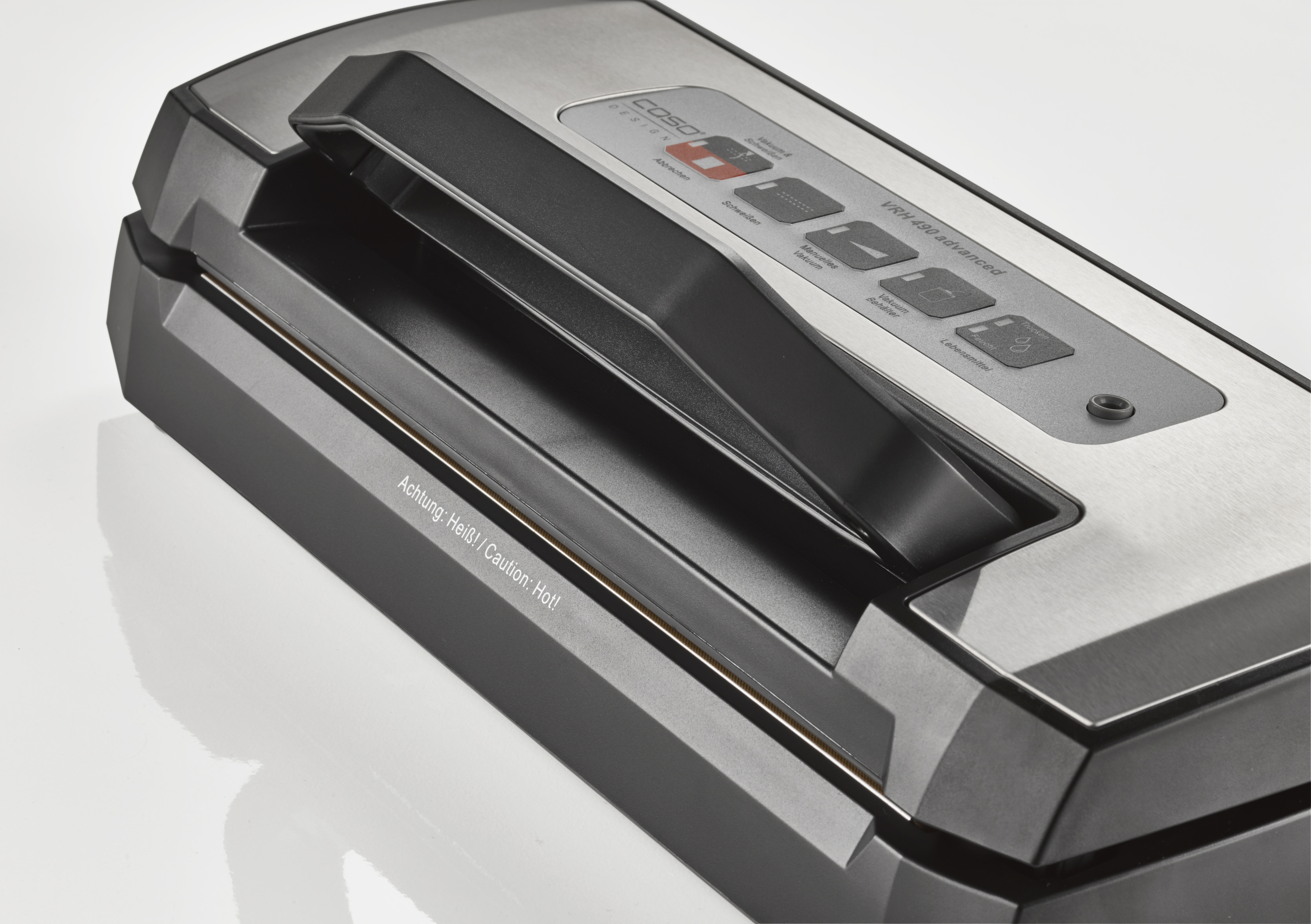 Ein Vakuumierer mit dem Text 'Achtung: Heiß! Vorsicht: Heiß!'.
