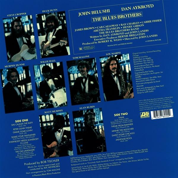 Album borító. Blues Brothers tagok öltönyben. Nevek és dalköcímek kék háttéren.