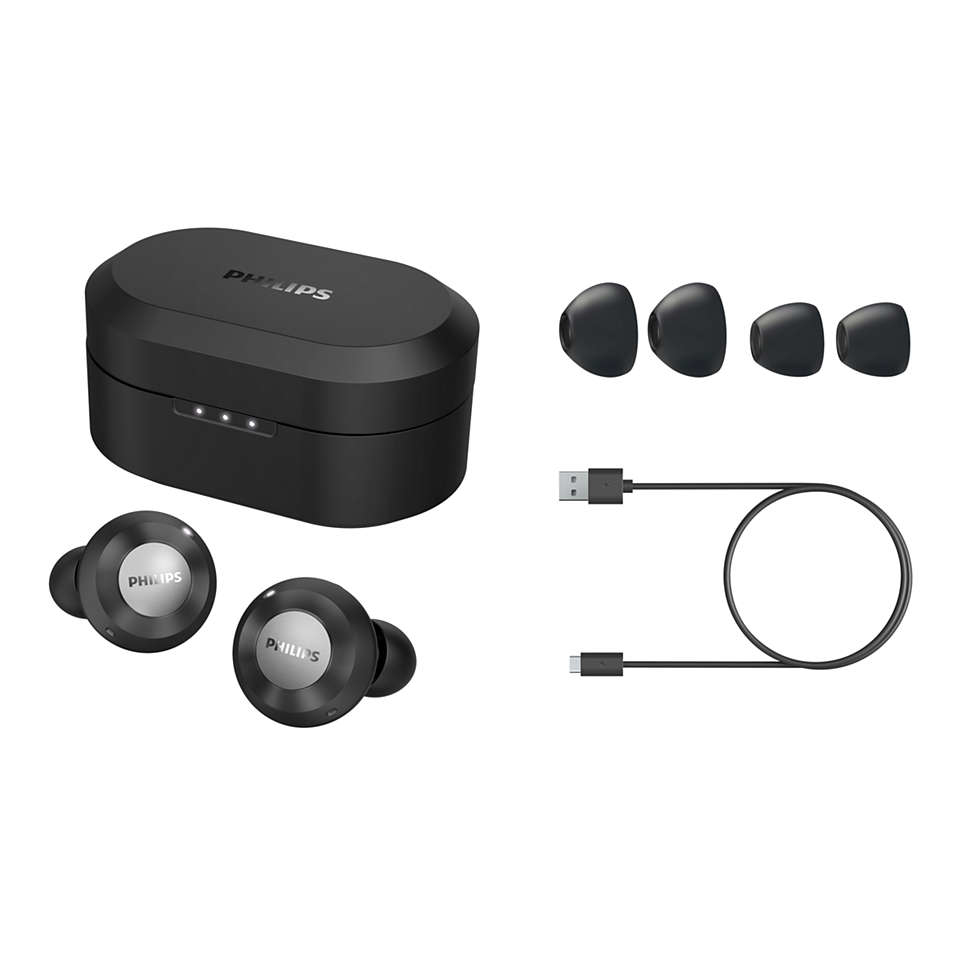 Schwarze Philips Ohrhörer, Ladecase, zusätzliche Ohrstöpsel und Ladekabel.