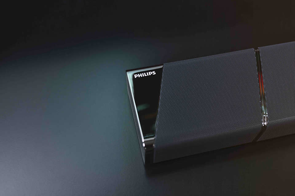 Philips Soundbar und Subwoofer, mit abnehmbaren Lautsprechern, isoliert auf Weiß.