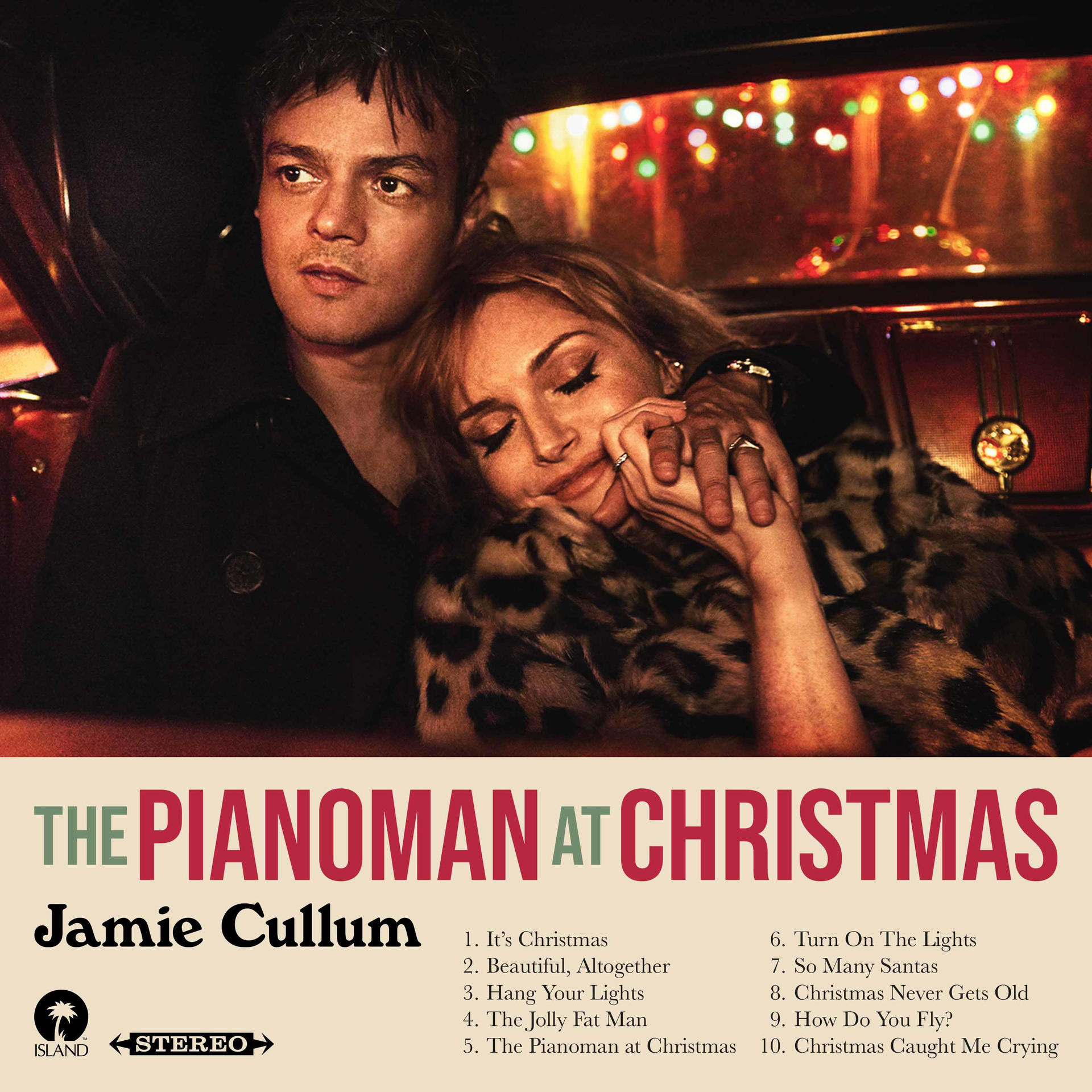 Album borítója egy párral az autóban, szöveg alul. Az album címe: „The Pianoman...Christmas“.