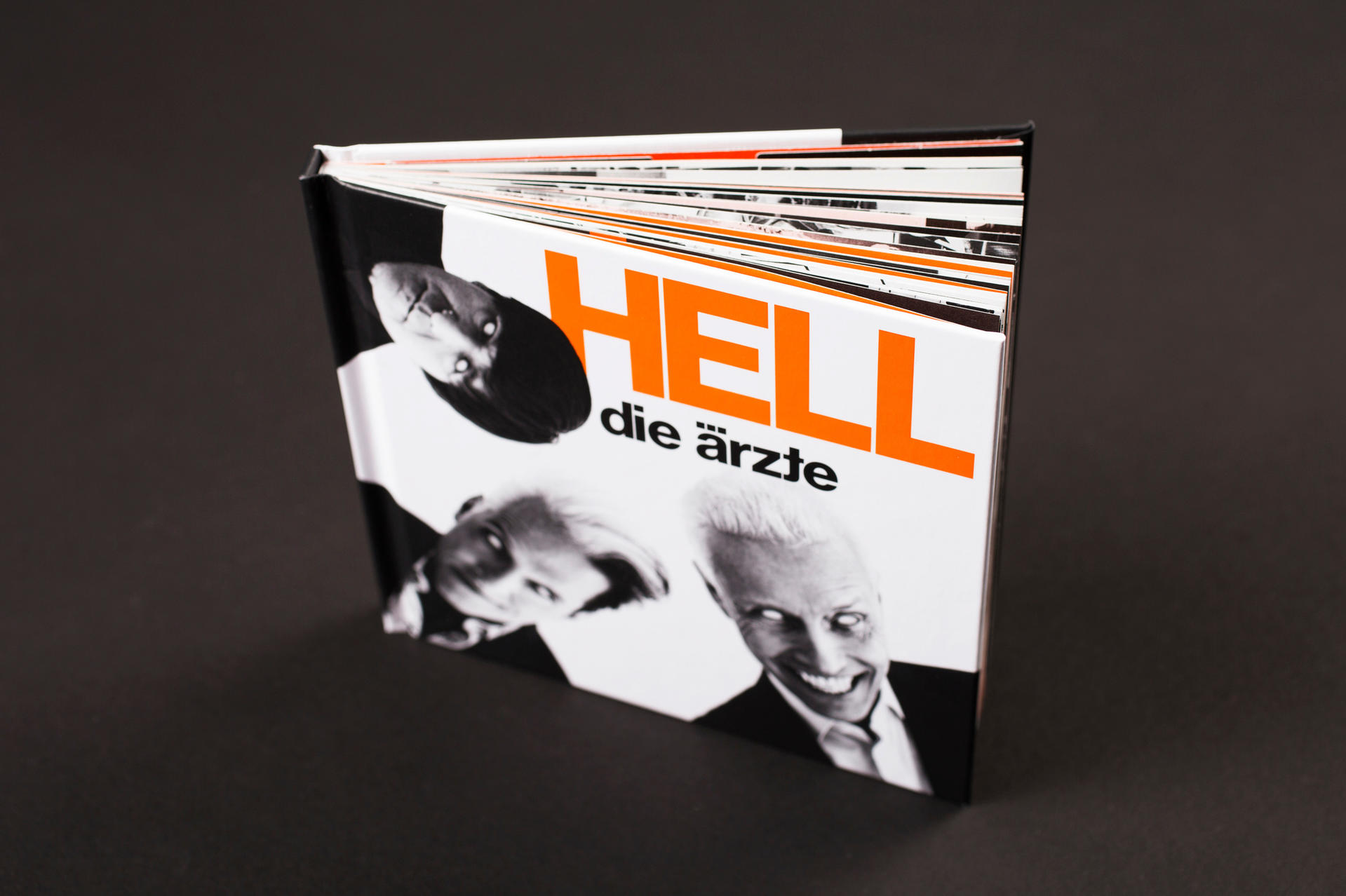 Buchcover von HELL die Ärzte mit Gesichtern von drei Bandmitgliedern.