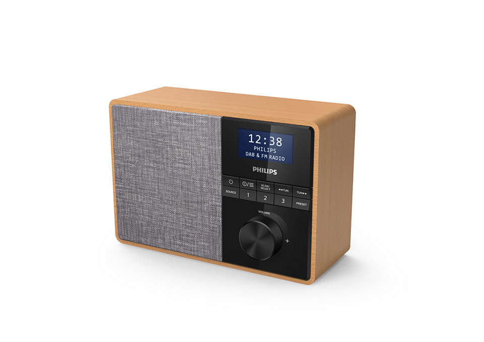 Wooden Philips radio with screen displaying time and station info, on a white surface.