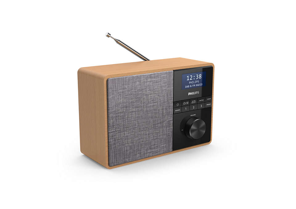 A wooden radio with a black face and antenna.