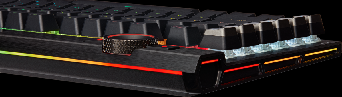 Gros plan sur un clavier avec un bouton de contrôle et des touches éclairées.