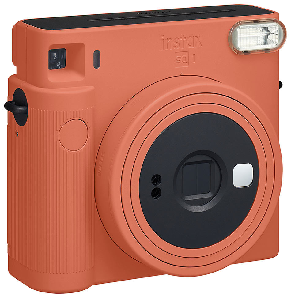 Orange Instax SQ1 instant camera with a black lens and flash. White background.