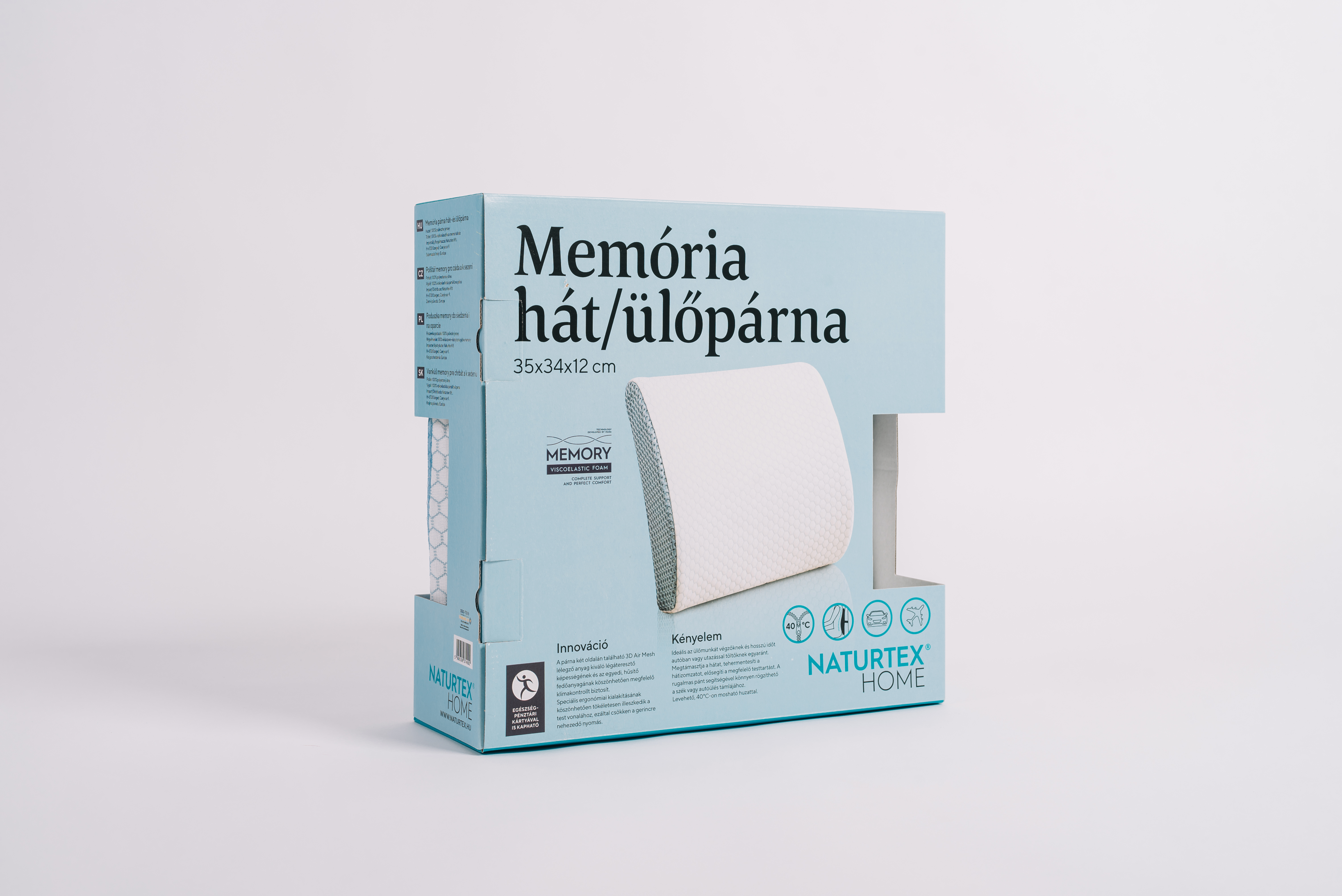 Egy memóriahab párna doboz, magyar nyelvű szöveggel, fehér felületen.