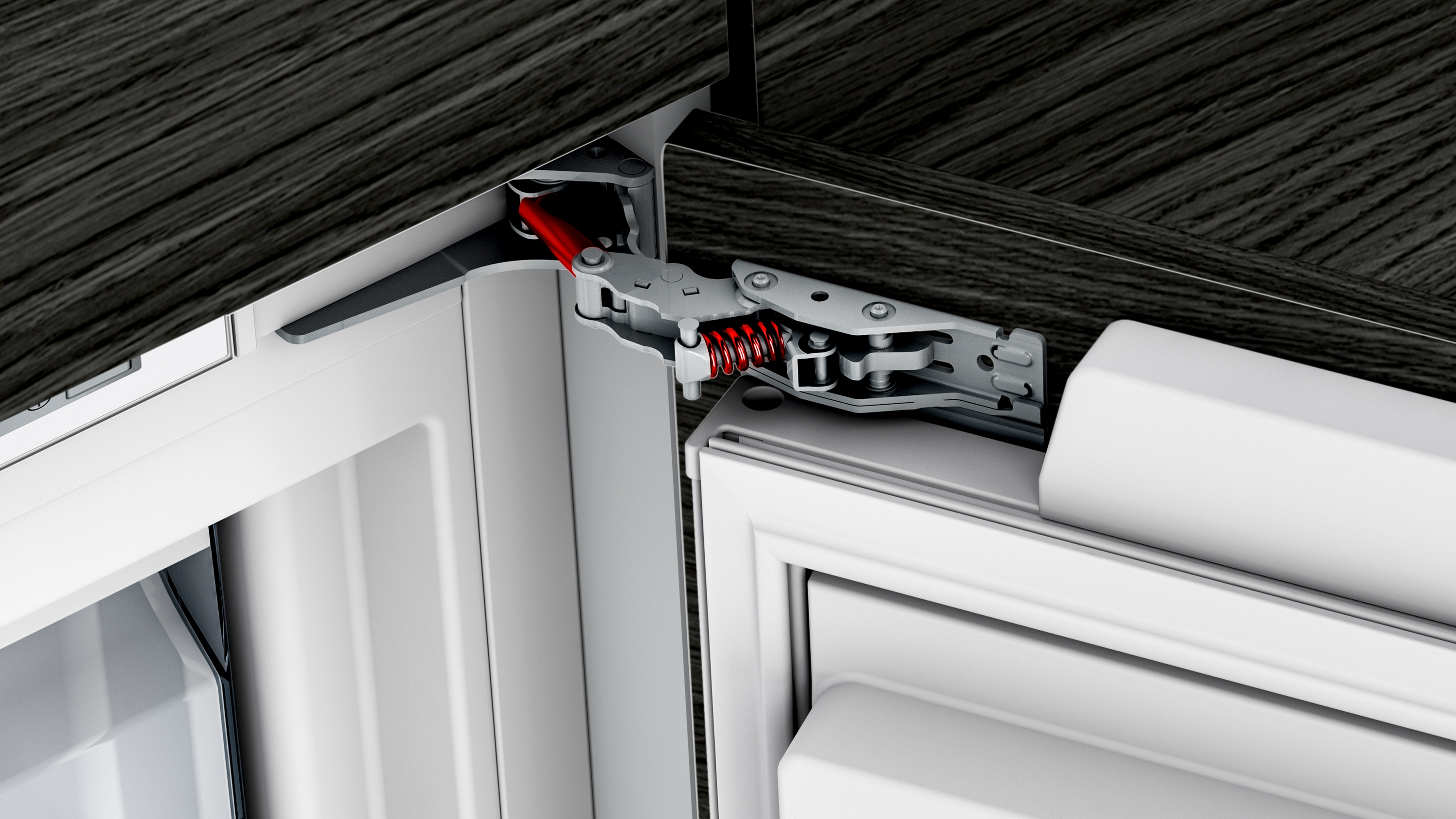 Metallscharnier mit roter Feder und schwarzem Holzdetail.
