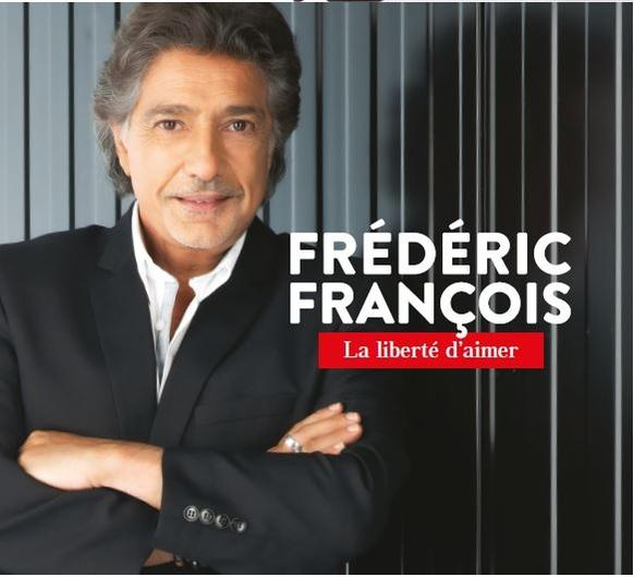 Pochette de l'album de Frederic Francois. Un homme en costume noir sourit. Texte en blanc et rouge.