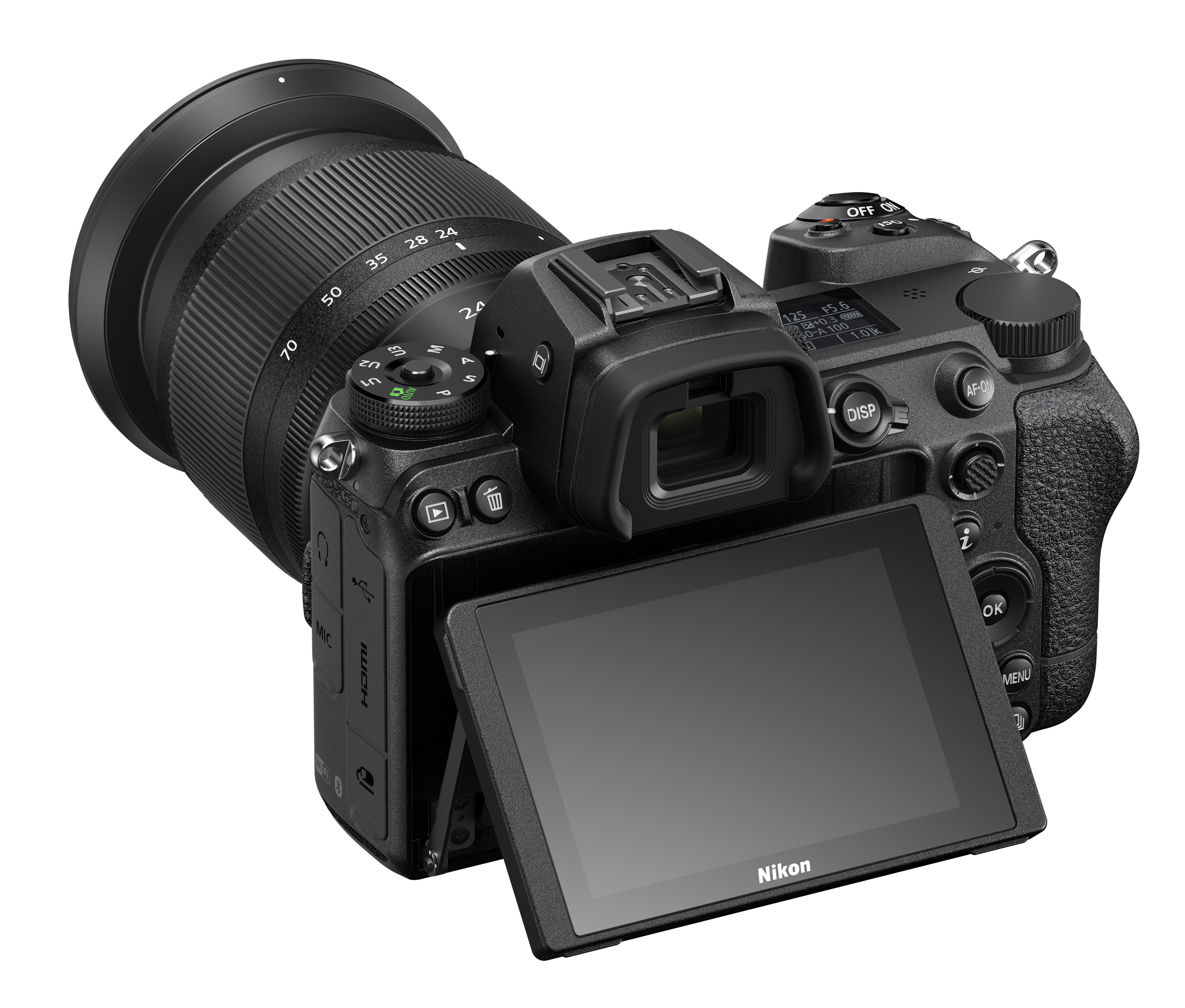 Draufsicht auf eine Nikon-Kamera. Bildschirm offen, mit Objektiv. Schwarzes Gehäuse.