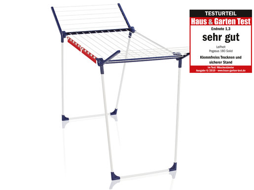 Weiß-blauer Wäscheständer mit Testurteil-Aufkleber an der Seite.