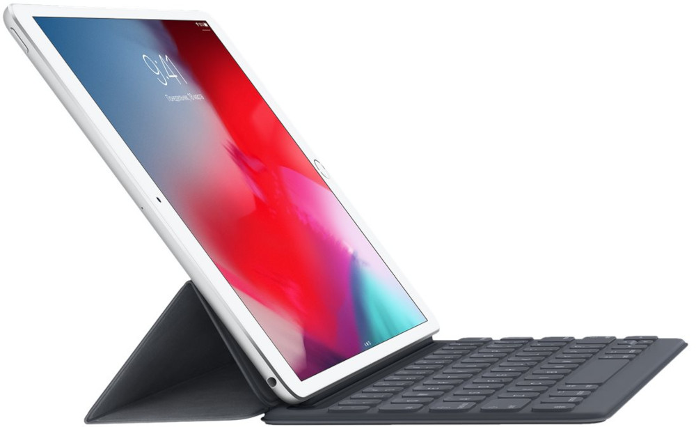 An iPad Pro with a keyboard case. The screen shows an interface. The case is dark grey.