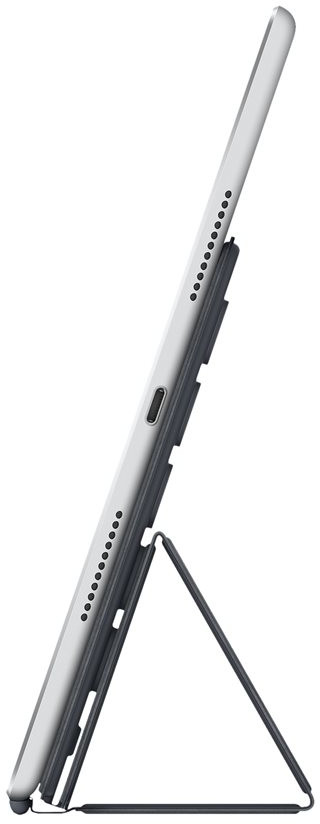 Tablet device in a dark gray case, propped up with a stand.