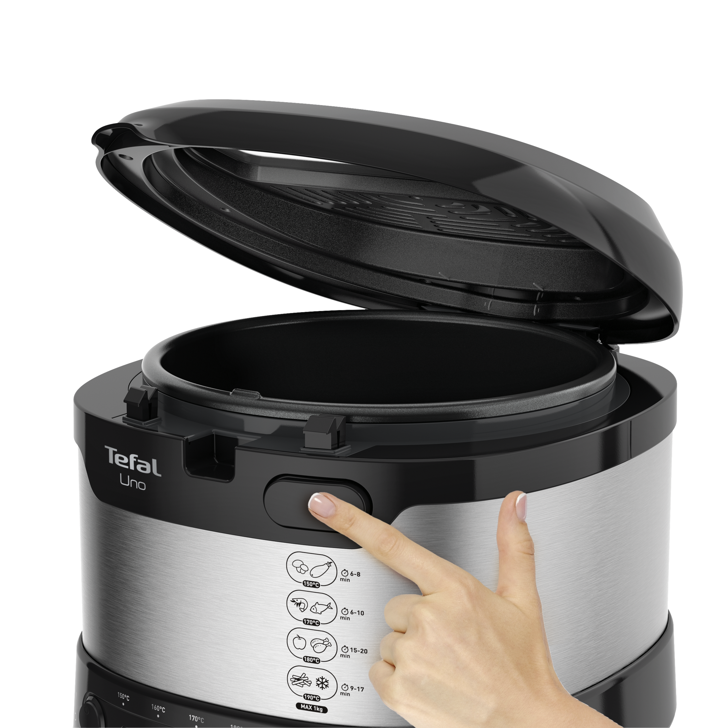 Személy megnyomja a gombot a Tefal Uno-n. A sütő fekete és ezüst, a fedél nyitva.