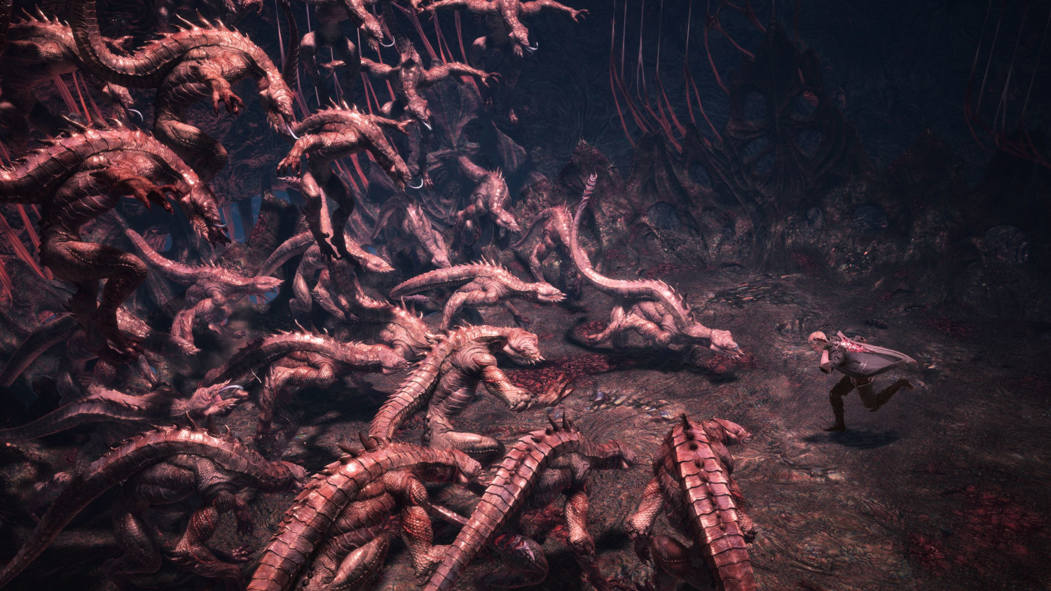 Un guerrier fuit une horde de dragons rouges dans une grotte sombre.