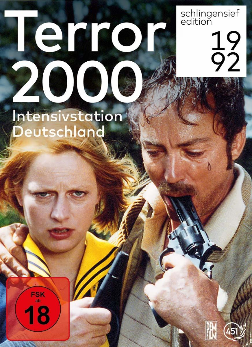 DVD-Cover von Terror 2000. Ein Mann hält eine Waffe an seinen Mund, eine Frau schaut zur Seite.